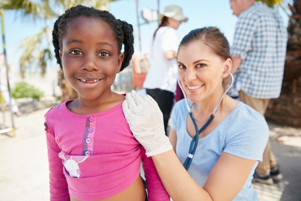 Child with a healthcare professional at a community clinic